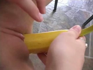 Shaved pussy having fun with a bannana...