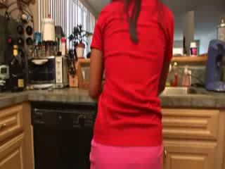 Asian chick stripping in a kitchen