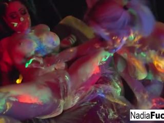 Black-light Babes Suck Off Colorful Cock