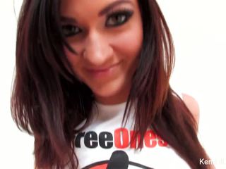 Kendall teases the camera in a FreeOnes shirt